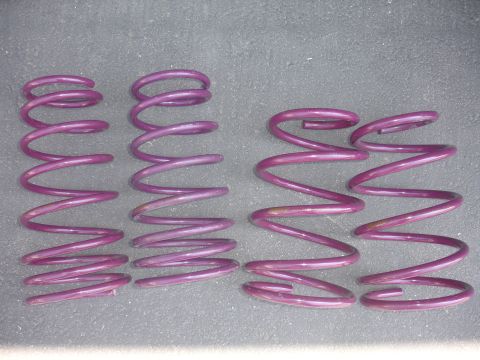1993 Ford Taurus - A set of four purple coil springs, likely aftermarket performance parts, are displayed against a neutral background.