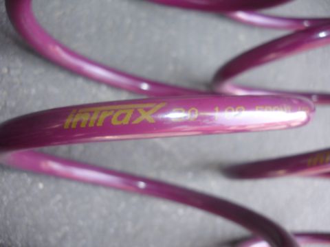 1993 Ford Taurus - Close-up of a purple Intrax coilover spring, showing the model number '30-102' printed in yellow.