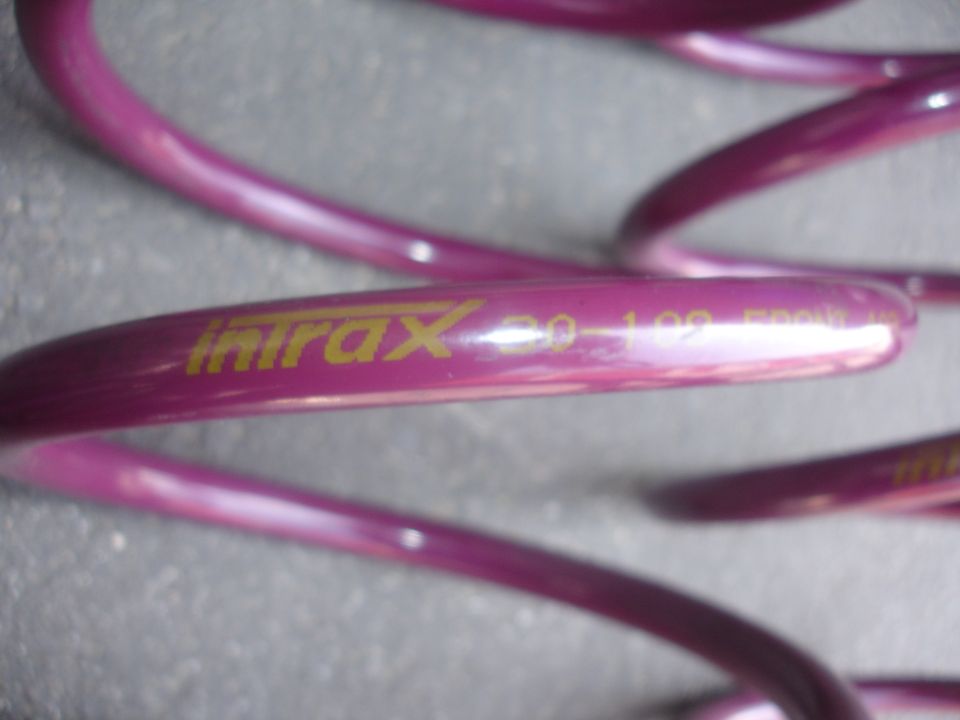 Purple coilover spring with yellow 'Intrax 30-102' text
