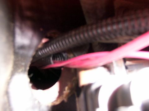 1998 Ford Taurus - Close-up view of automotive wiring and tubing, with a Supermotors watermark.