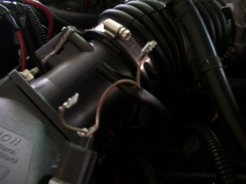 1998 Ford Taurus - Engine air intake assembly detail with visible hoses and electrical connections.