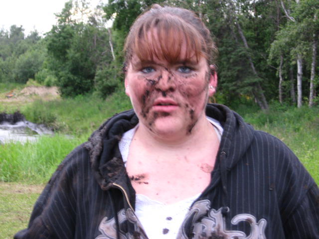 Woman with dirt on her face and clothes