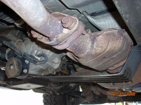 2004 Ford Ranger - Underside view of the exhaust system on a 2004 Ford Ranger, including the catalytic converter and piping.