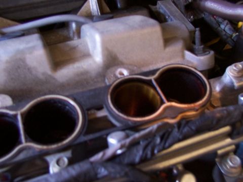 1998 Ford Taurus - Engine intake manifold showing two intake ports, part of a larger engine assembly.