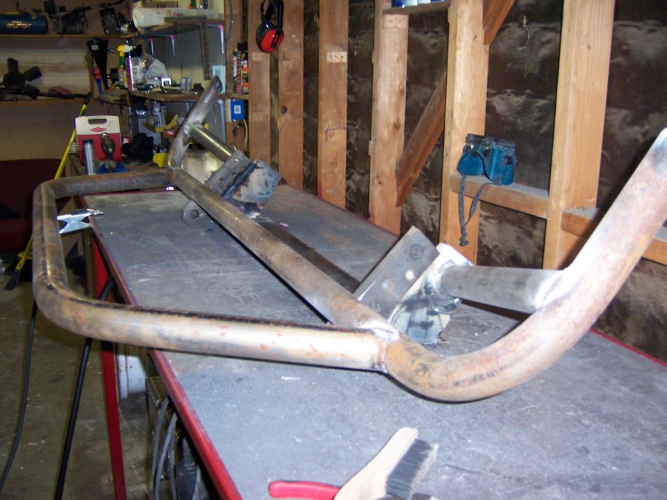 Fabricated tubular steel bumper on a garage work table