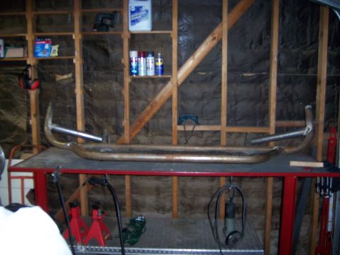 1991 Ford Bronco - Photograph of a fabricated tube bumper in a garage, not a technical document.