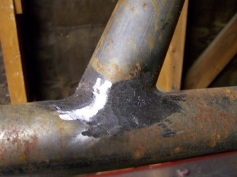 1991 Ford Bronco - Photograph of a welded steel tube joint, not a technical document.