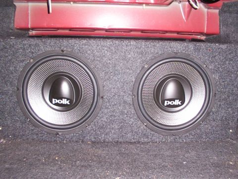 1998 Ford Taurus - Two Polk subwoofers are installed in the trunk of a car.