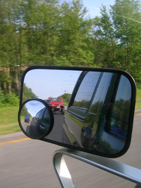 1996 Ford Bronco - View of other vehicles on the road through a side mirror.