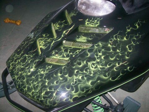 1997 Arctic Cat Powder Special EFI - Custom painted snowmobile hood with green flame graphics and mesh vents.
