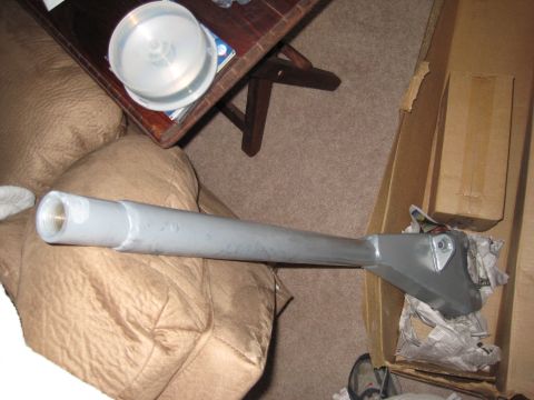 1995 Ford Bronco - An automotive part, possibly a drive shaft or axle, is shown on a couch.