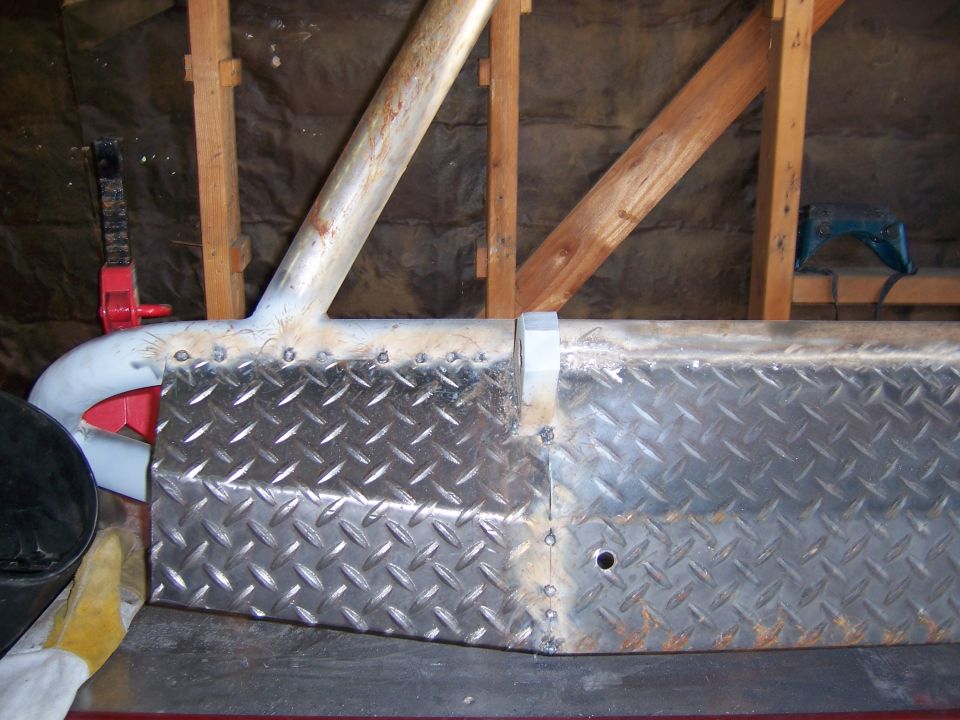 Custom fabricated front bumper with diamond plate and metal tubing