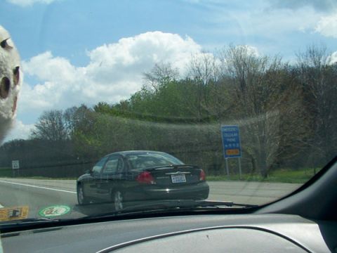 1998 Ford Taurus - A 1998 Ford Taurus is seen from behind while driving on a highway.