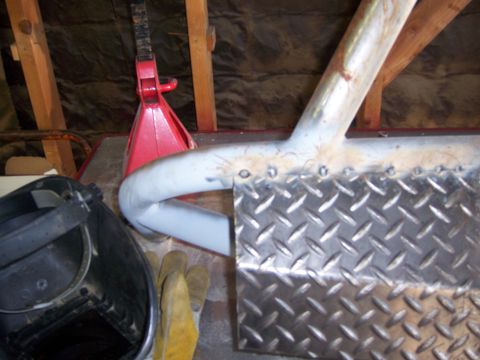 1991 Ford Bronco - Custom bumper fabrication in progress, showing diamond plate and tubing with welding supplies nearby.