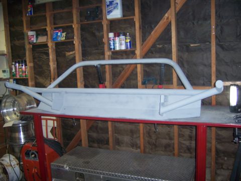 1991 Ford Bronco - A custom-fabricated front bumper, likely for an off-road vehicle, is shown in a workshop setting.