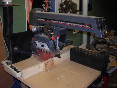 1995 Ford Bronco - A Craftsman radial arm saw is set up on a wooden workbench, ready for use.