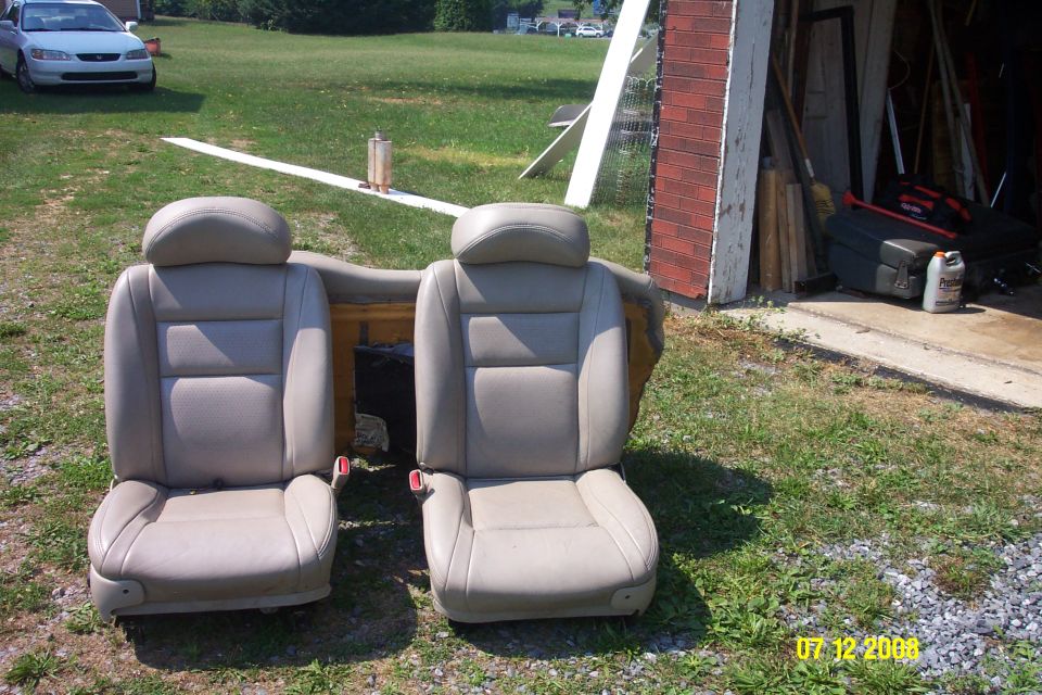 Pair of tan leather car seats