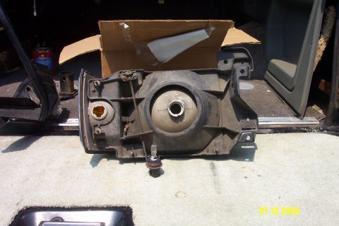 1992 Ford Bronco - This is a close-up of a vehicle's headlight assembly, likely removed for repair or replacement.