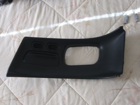 1995 Ford Thunderbird - Interior trim piece with air vents and a large opening, likely for a radio or storage.