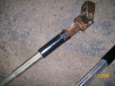 1995 Mercury Grand Marquis - A rusty steering shaft u-joint with black tape is shown against a concrete background. The date 07/17/2008 is visible.