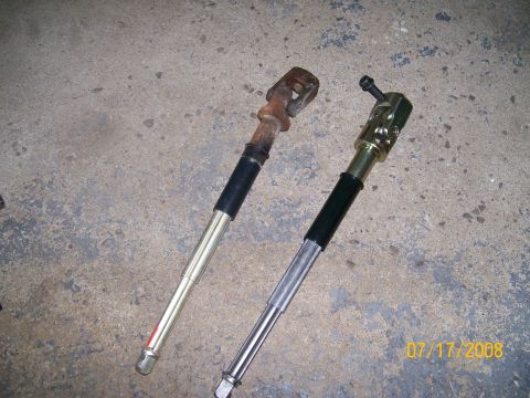 1995 Mercury Grand Marquis - Comparison of a worn steering shaft with a new replacement part.