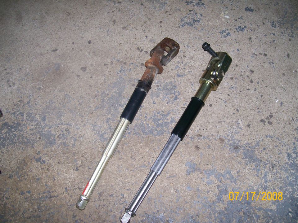 Rusty and new steering shafts side-by-side