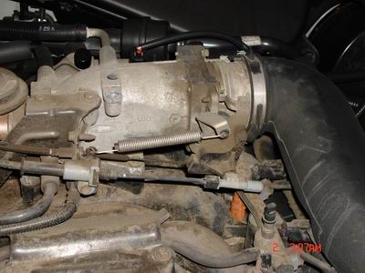 1998 Ford Crown Victoria - This image shows a close-up view of a vehicle's engine throttle body and associated components.