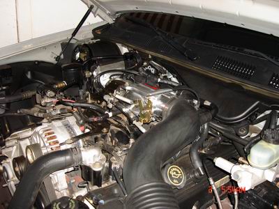 1998 Ford Crown Victoria - Engine bay of a 1998 Ford Crown Victoria, showing various components and wiring.