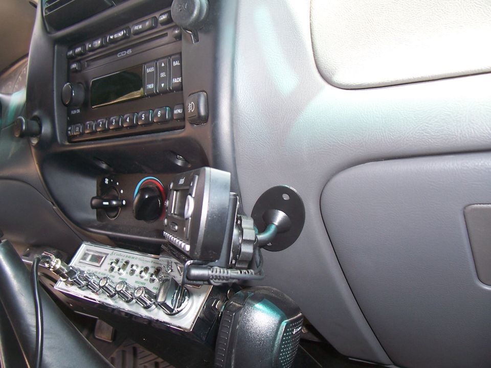 2003 Ford Ranger interior showing dashboard with CD player, CB radio, and microphone