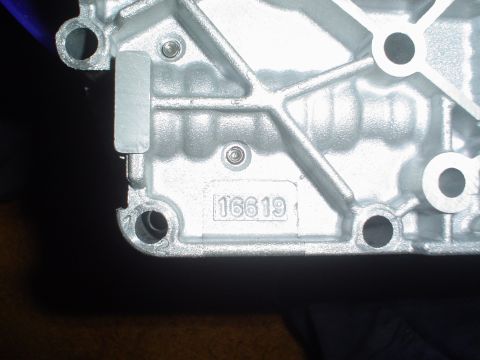 1996 Mercury Grand Marquis - Close-up of a metal engine component showing the stamped identification number 16619.