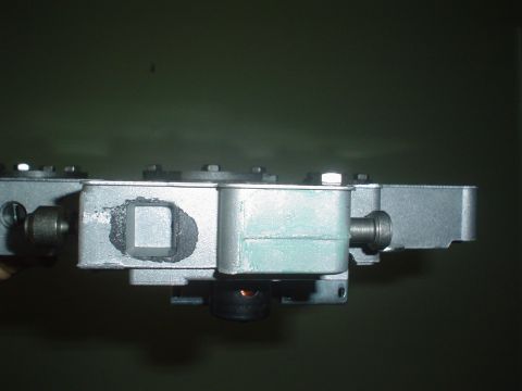 1996 Mercury Grand Marquis - A metal component with visible bolts and a square cutout is shown in a side profile.