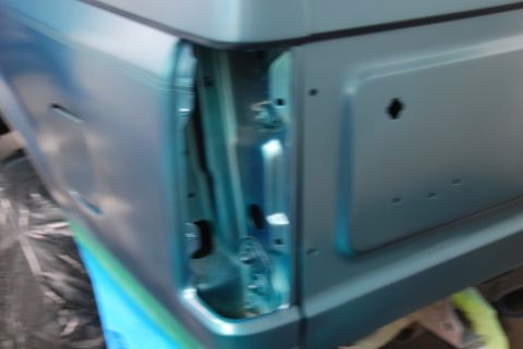 1996 Ford Bronco - Close-up of the rear quarter panel on a 1996 Ford Bronco, highlighting the door jamb details.