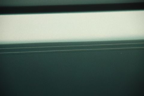 1996 Ford Bronco - Abstract view of a textured surface with distinct horizontal lines and a gradient to a bright upper area.