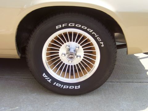 1979 Chevrolet Camaro - Close-up of a car's wheel and tire BFGoodrich Radial T/A branding and a turbine-style rim.