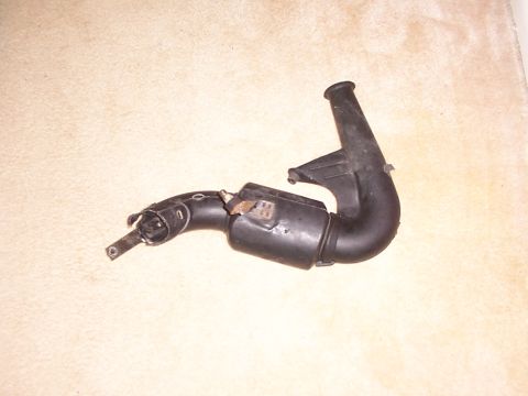 1998 Ford Taurus - A black plastic air intake hose is shown against a light-colored background.