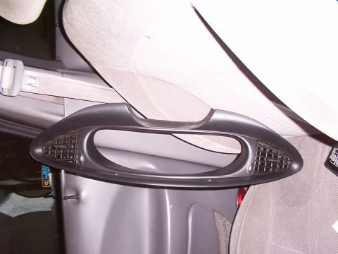 1998 Ford Taurus - Close-up of a car's interior grab handle, showing its design and texture.