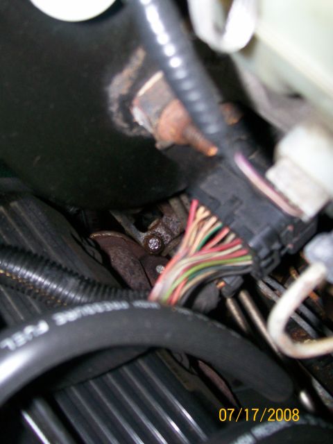 1995 Mercury Grand Marquis - A close-up view of engine wiring and a fuel line, with a date stamp of 07/17/2009.