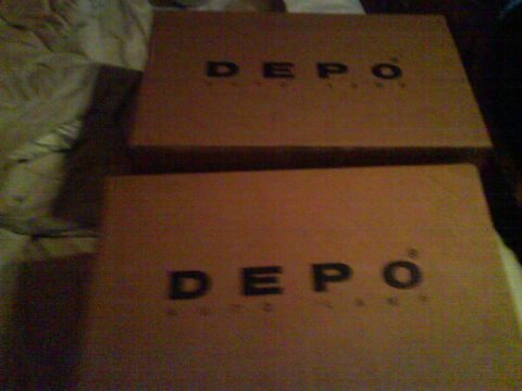 2003 Ford Crown Victoria - Two cardboard boxes with the "DEPO" logo are visible in the image.
