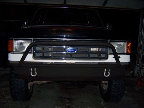 1991 Ford Bronco - Front view of a 1991 Ford Bronco, a custom front bumper with tow hooks and the iconic Ford grille.
