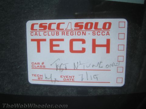 1985 Ford Mustang - A CSCCASOLO CAL CLUB REGION SCCA TECH sticker is affixed to a dark surface.