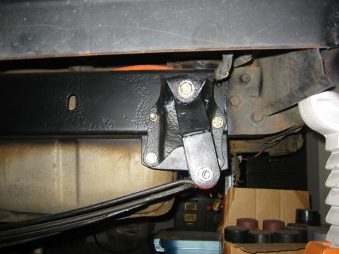 1995 Ford Bronco - Close-up view of a leaf spring mount attached to the vehicle's frame.