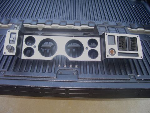 1979 Chevrolet Camaro - A vehicle's dashboard instrument cluster, gauge openings and air vents, is placed in the bed of a pickup truck.