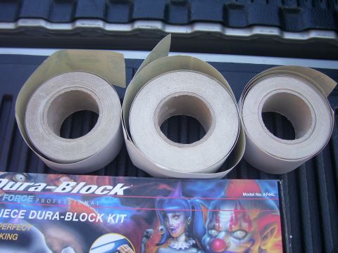 1979 Chevrolet Camaro - A Dura-Block kit and rolls of sandpaper are displayed on a dark, textured surface.