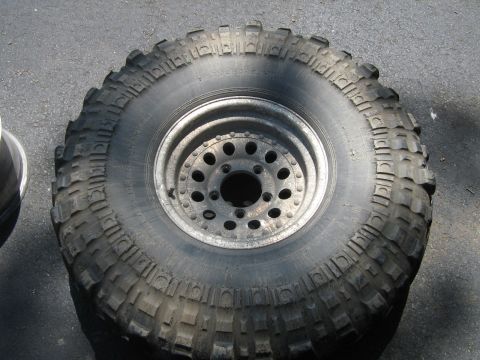 1990 Ford Bronco - Close-up of a single off-road tire and wheel assembly.