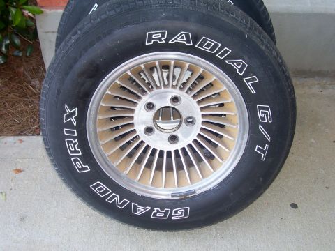 1979 Chevrolet Camaro - Two tires and wheels are shown, with text on the tires reading "GRAND PRIX RADIAL G/T".