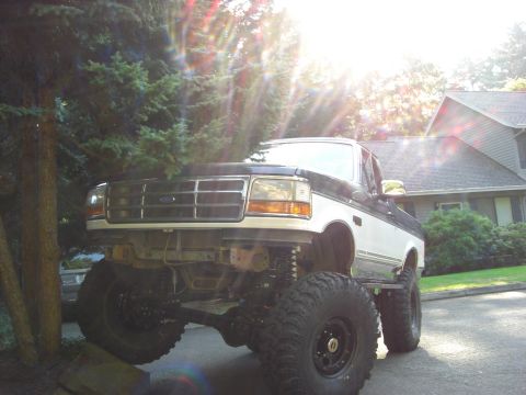 1993 Ford Bronco - This heavily modified Ford truck features an extreme lift kit and oversized off-road tires.