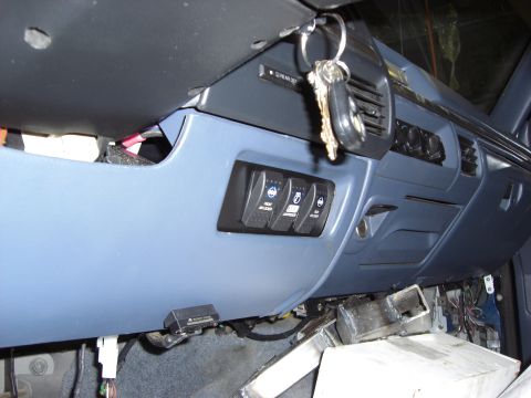 1993 Ford Bronco - Interior view of a blue dashboard with auxiliary switches and keys, likely from a 1992 Ford truck.