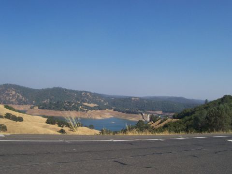 1994 Ford F-150 - A scenic view of a lake and rolling hills under a clear blue sky.