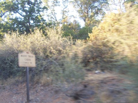 1994 Ford F-150 - Signpost indicates the direction to Mark Twain Cabin in a natural setting.