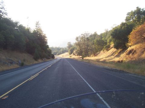 1994 Ford F-150 - Driving on a highway through a scenic, tree-lined landscape during the day.